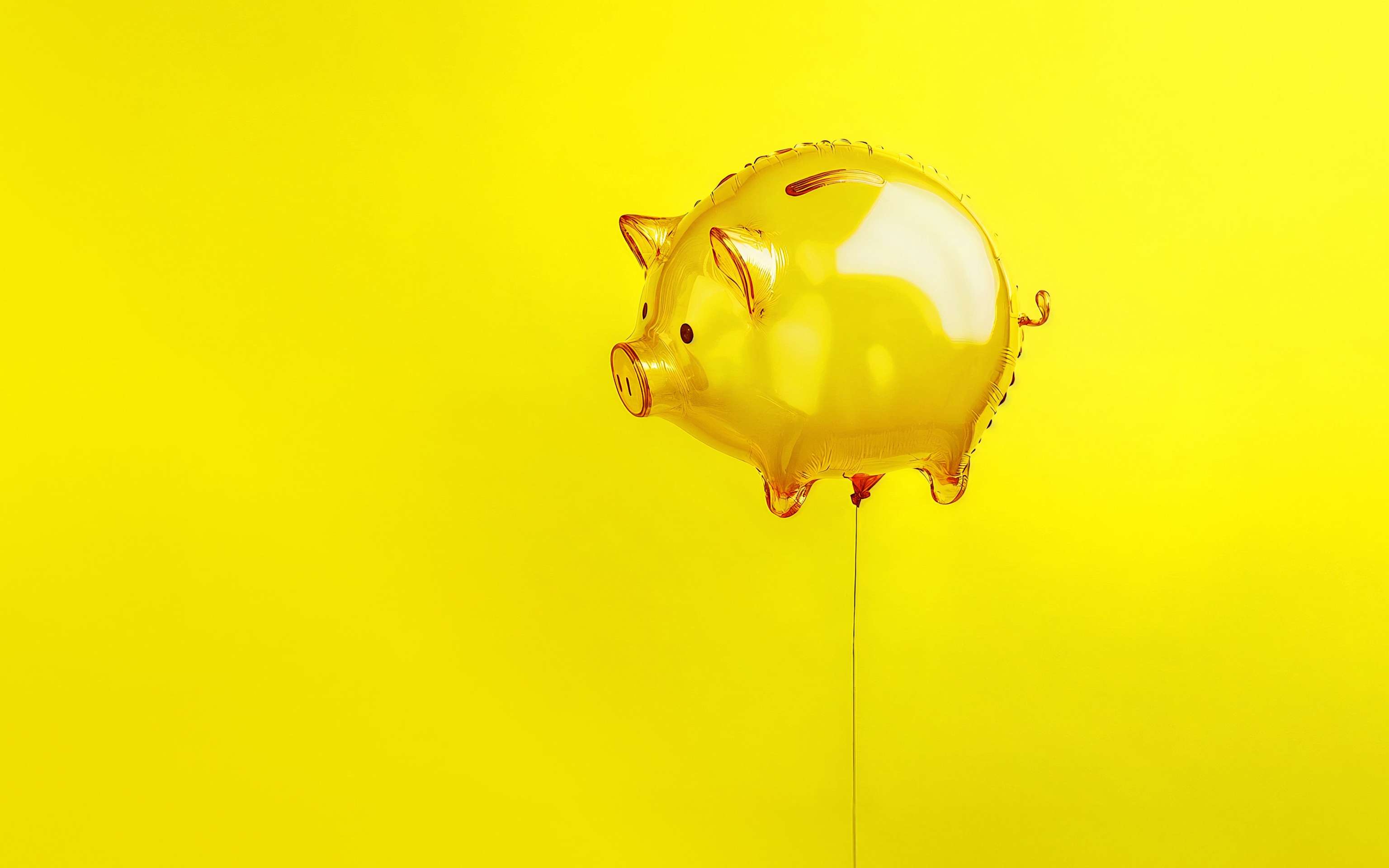 Ein gelbes Sparschein als Luftballon an einer Schnur - KI Generiert Ein gelbes Sparschein als Luftballon an einer Schnur - KI Generiert